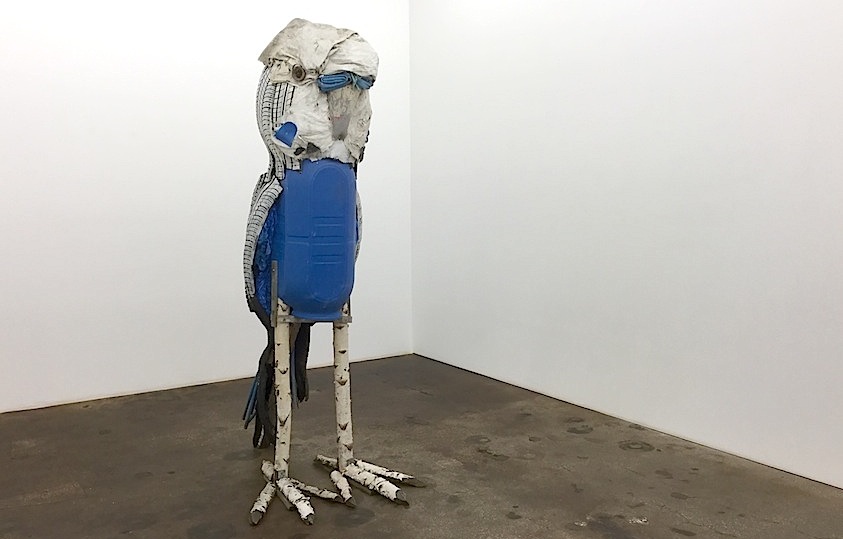 Matthias Garff: Kiki, 2015, birch trunks, tires, plastics, aluminum, screws, lake, 255 x 115 x 145 cm

